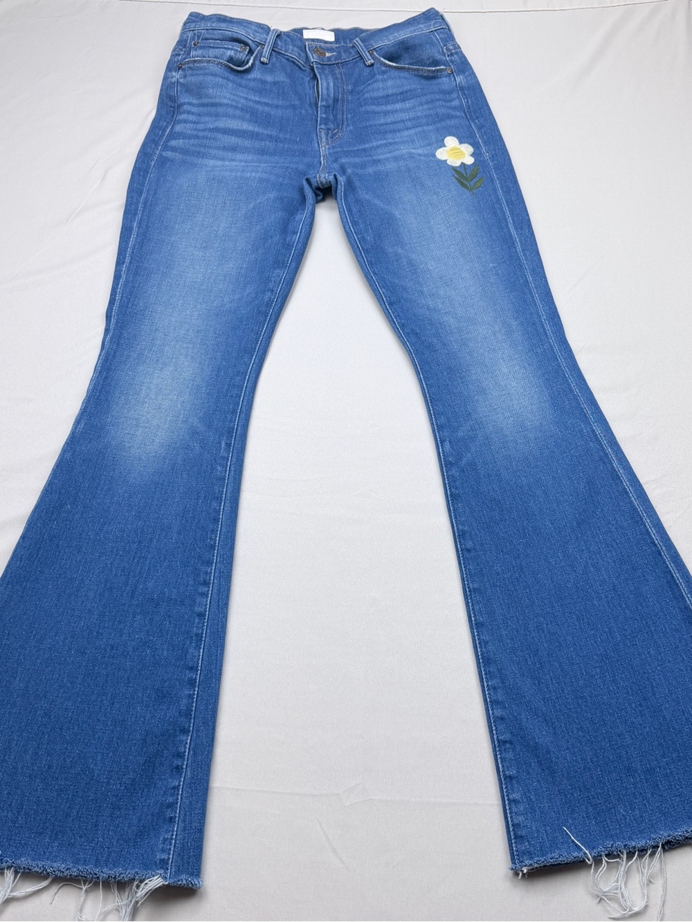 MOTHER The Weekender Fray high-rise bootcut jeans in a "Gold Rush" wash
